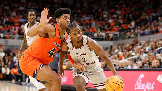 Nov 18, 2022; Auburn, Alabama, USA; Auburn Tigers center Dylan Cardwell (44) blocks Texas Southern Tigers forward Davon Barnes (2) during the first half at Neville Arena. Mandatory Credit: John Reed-USA TODAY Sports